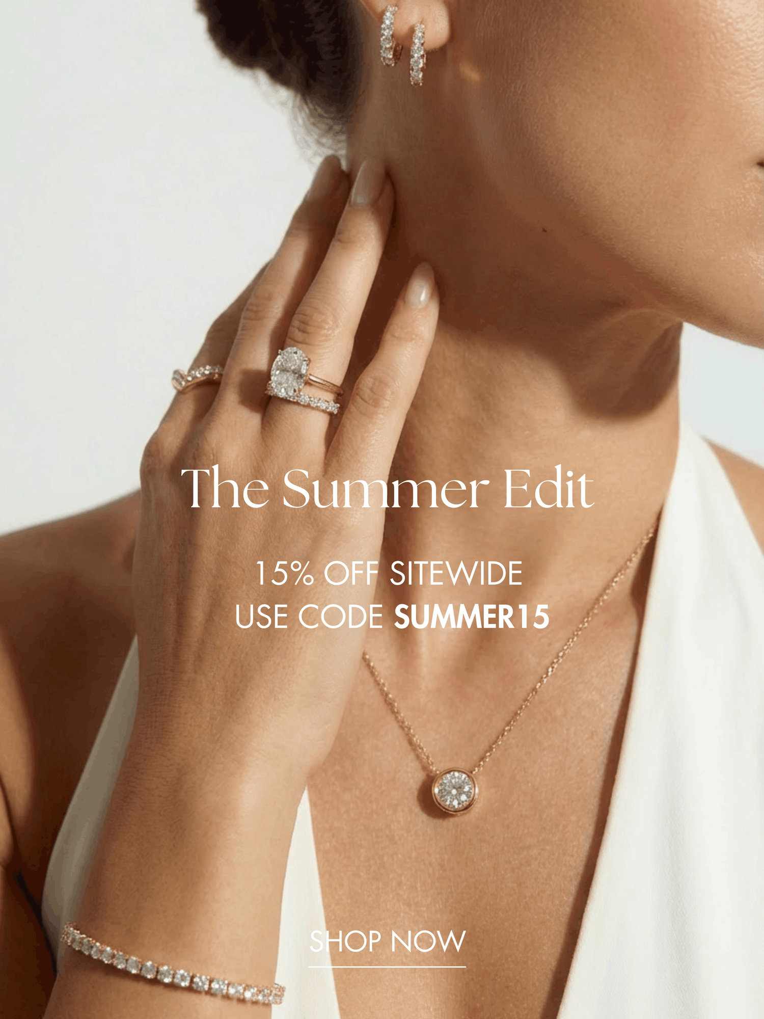 Woman wearing lab grown diamond jewelry including a tennis bracelet pendant necklace and engagement ring during Leonids Summer Sale with 15% off sitewide using code SUMMER15