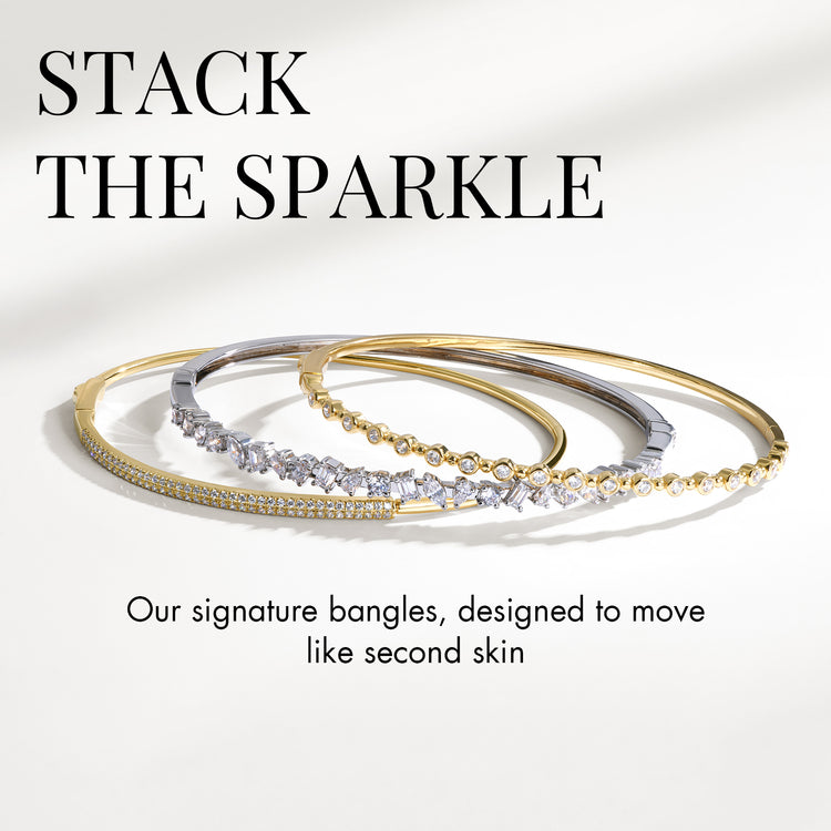 Three gold and silver bangles on a white background with text 'Stack the Sparkle'.