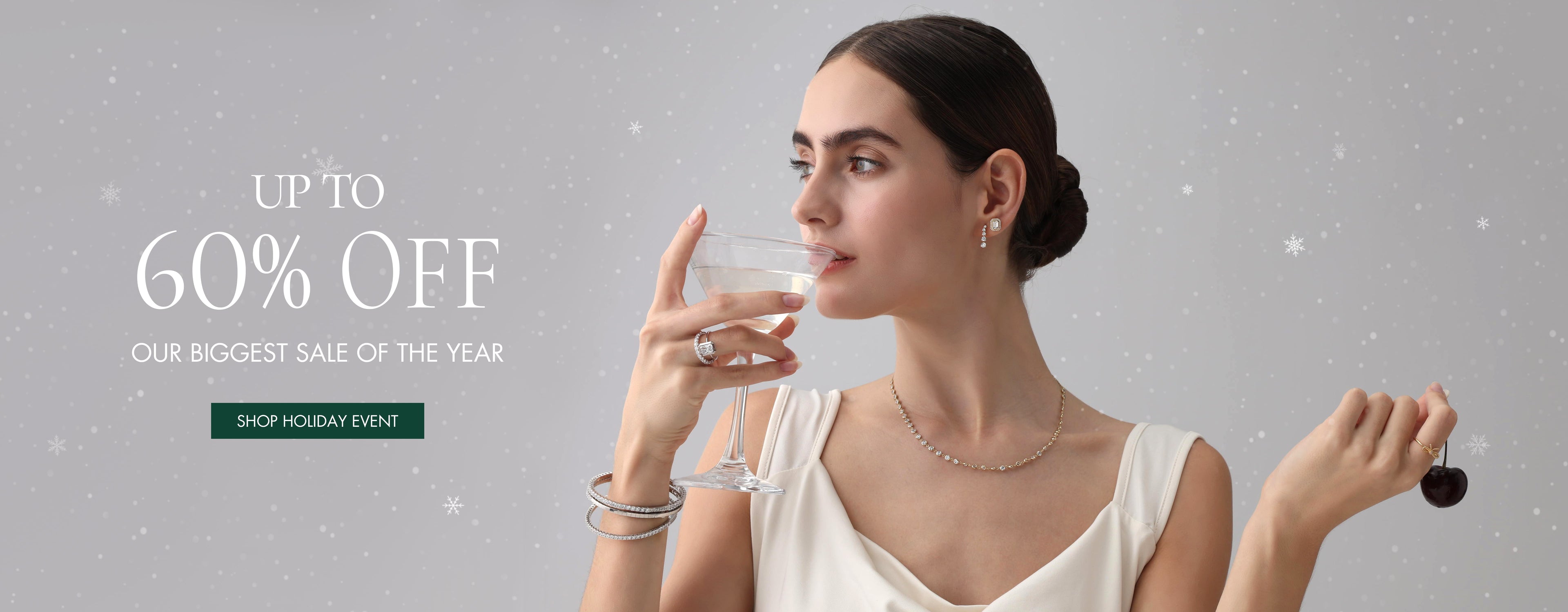 Woman holding a glass of water with jewelry on, promotional text for sale on a gray background