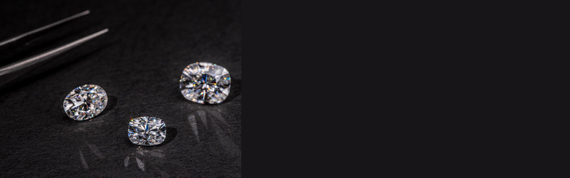 Three diamonds on a dark surface with a blurred background