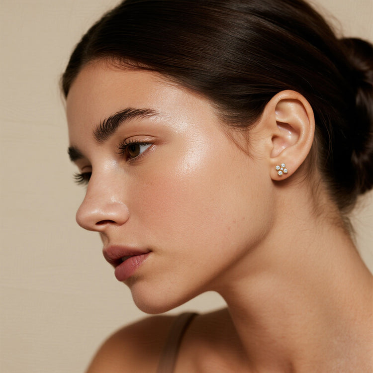 Close-up of a woman wearing lab diamond earrings